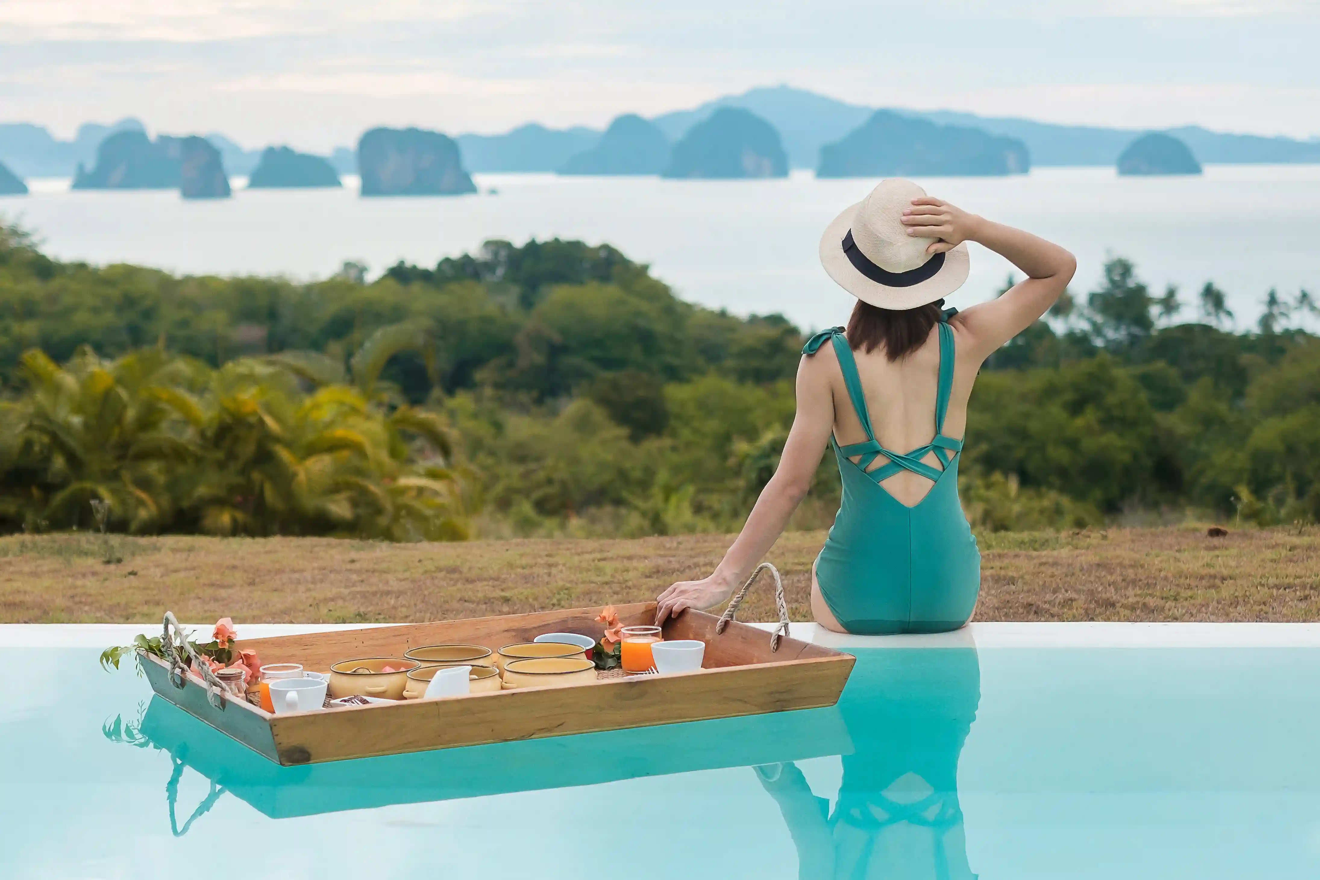 Woman floating in a luxury resort pool