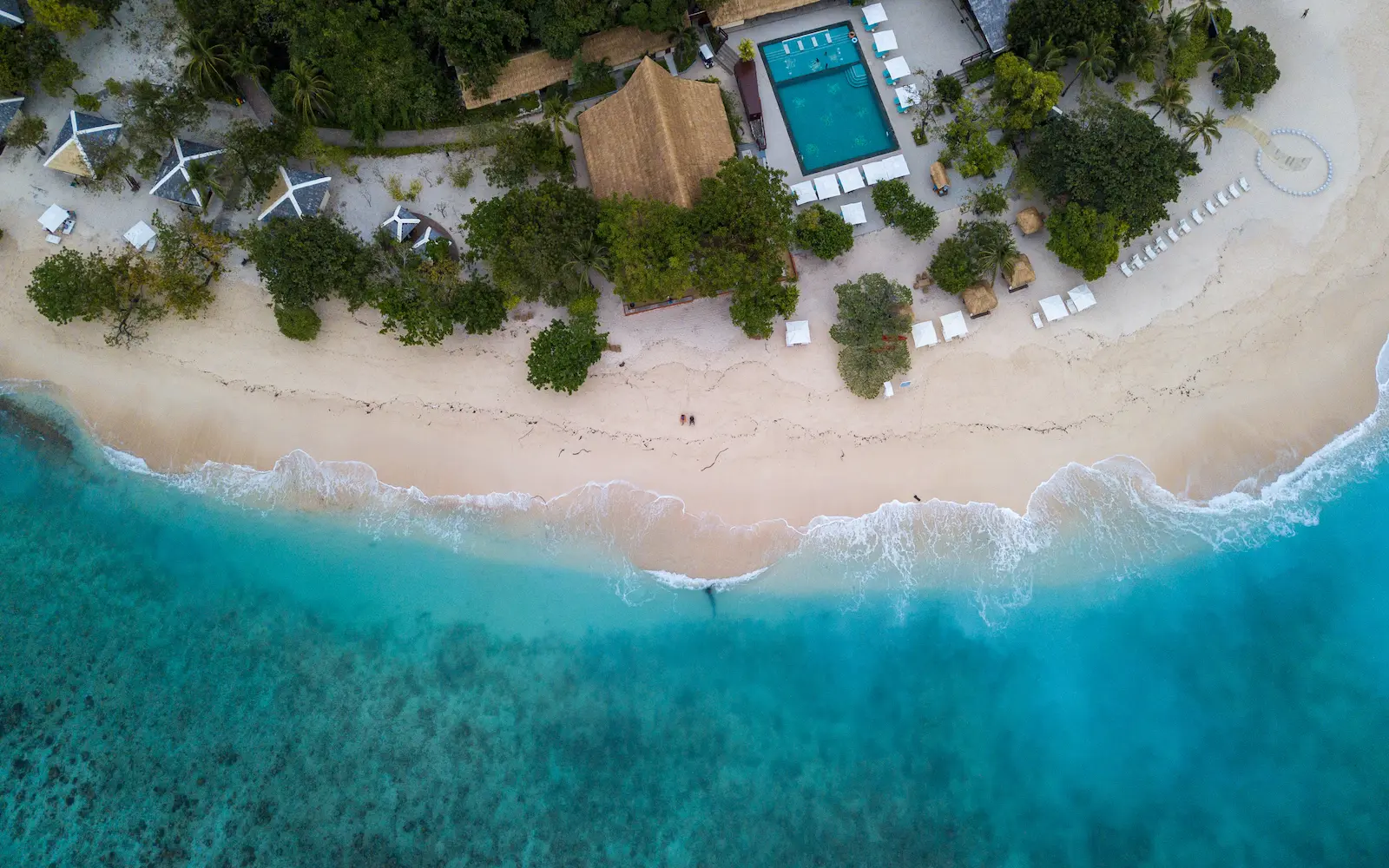 Private dining set on the beach at a luxury resort in the Philippines