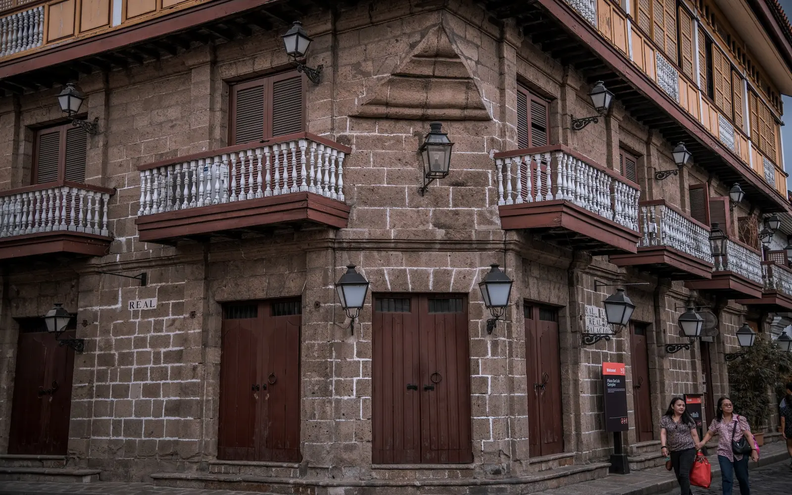 Spanish-colonial stone house with wooden balconies on Calle Real, Intramuros